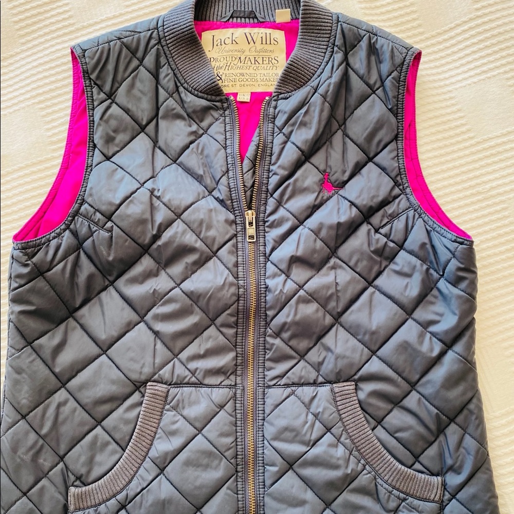 Navy blue lightweight vest with pink details.